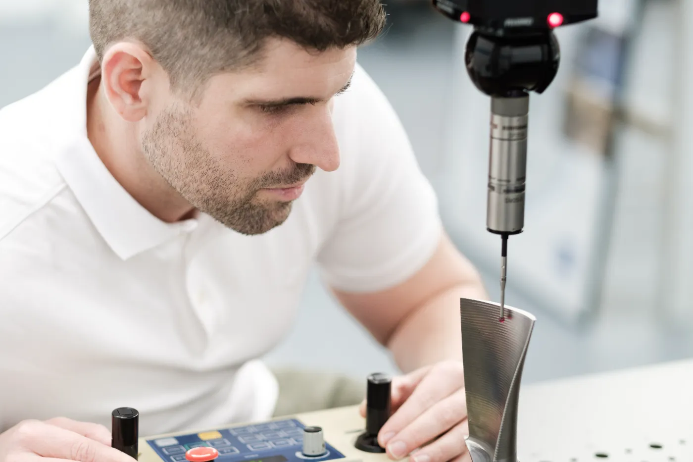 CSL metrology engineer measuring a turbine blade on a coordinate measuring machine